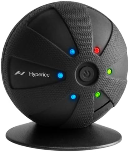 Hyperice Hypersphere Go negra, bola de masaje sobre base de apoyo con indicadores de color